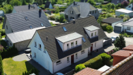 Luftaufnahme des Einfamilienhauses - Tolle Lage und gehobene Ausstattung: Doppelhaushälfte in Elmenhorst
