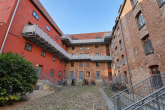 Innenhof mit Fahrrädern und Balkonen - Investmentpaket in Top-Lage! 7 Wohnungen in der nördlichen Altstadt von Rostock.
